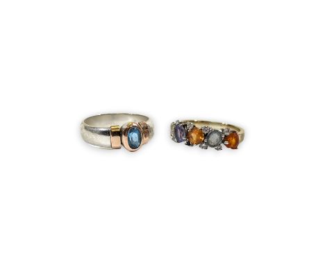 A multi-coloured sapphire set dress ring, stamped 750. Testing as 18ct white gold, size Q. Together with a silver blue stone 