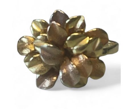 A palm inspired cocktail ring, marked with Italian 750 goldsmiths marks. Tests as 18ct gold. Gross weight approximately 8.70 