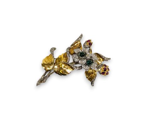 A 1940s Diamond, emerald and ruby floral spray brooch.  Set with two emeralds en cabochon, seven mixed cut rubies and 40 eigh