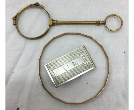 A pair of lorgnettes; together with a silver money clip and a gold bangle