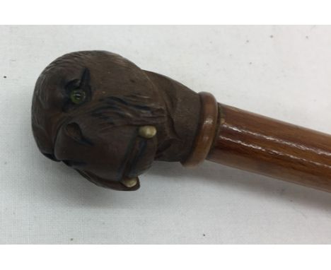 A 19th century swagger stick with carved walrus head