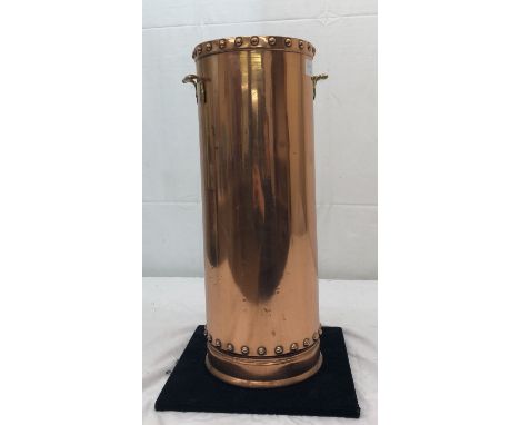 A vintage copper stick stand modelled from a fire extinguisher