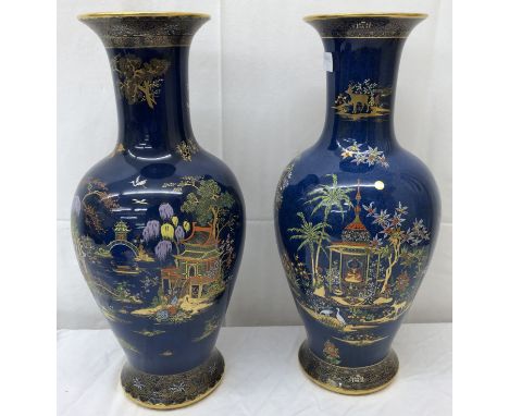 A pair of large Carltonware vases: one depicting an Oriental scene; the other depicting an Indian scene