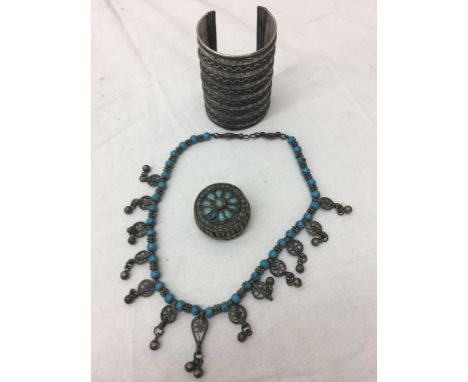 A glass set white metal box; together with a necklace and a large bangle