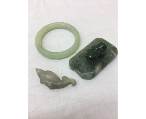 A fish and bowanite bangle; together with a jade bear and salmon