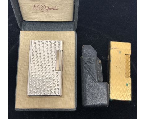 A boxed Dupont lighter; together with a Dunhill example