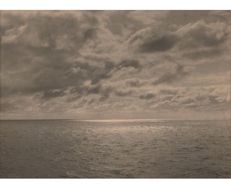 Larisch-Moennich, Count Franz von -- "Tropische Wolkenpracht". Circa 1910. Vintage platinum print flush-mounted to cardboard.