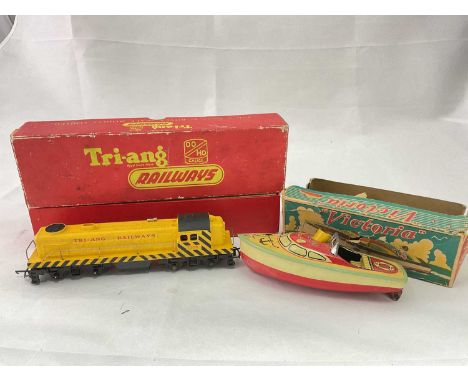 TRI-ANG; a boxed R155 diesel switcher in yellow livery, and a boxed Victoria tinplate clockwork model of a boat (2).