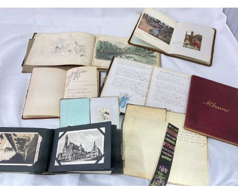 A group of ephemera including sketch books, albums and postcards.