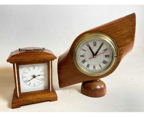 A ship's style brass face clock, now in a central propeller section, and a mantel timepiece (2).