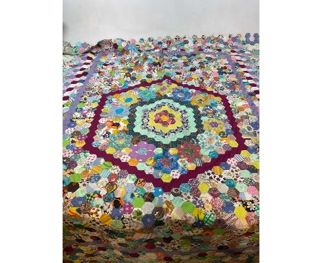 A vintage unfinished patchwork quilt.