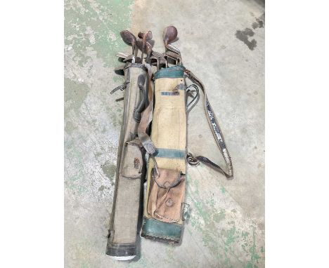 Two bags of vintage simulated hickory shafted golf clubs.