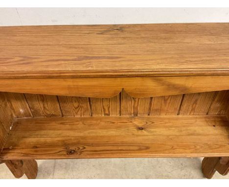 A pine kitchen wall mounted shelf.