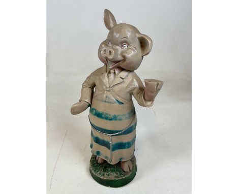 A vintage resin butcher's advertising pig, height 47cm.