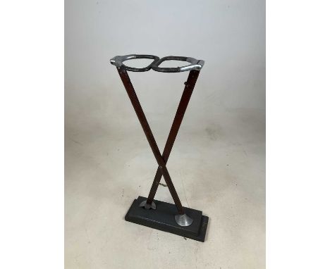 A vintage shooting stick now on an associated wooden plinth mounted as a display item, height 71cm.