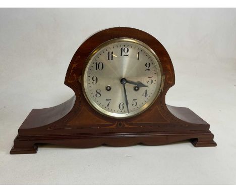An Edwardian mahogany and inlaid eight day mantle clock with Arabic numerals to the silvered dial, width 43cm.