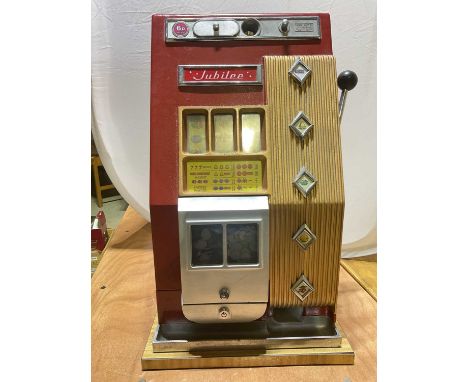 A vintage Jubilee one armed bandit.Condition Report: Unable to test the mechanism on this one armed bandit as cannot open &nb