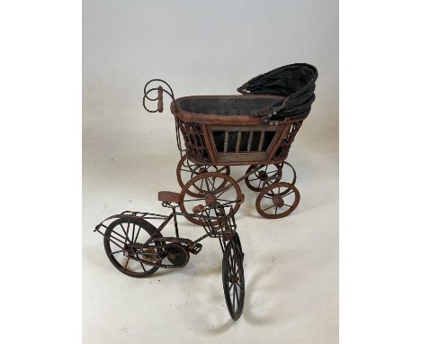 A doll's pram and a rustic scratch built miniature model of a bicycle (2).