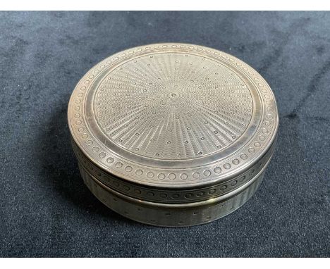 A French circular shallow silver box and cover with engine turned engraved detail throughout, diameter 6cm, approx 1.35ozt/42