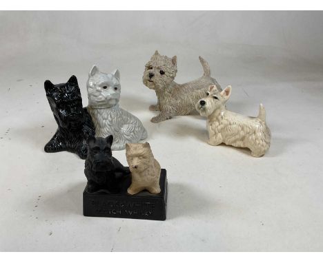 A plastic Buchanan's Black &amp; White Scotch Whisky advertising figure group, and three further West Highland/Scottie dog fi