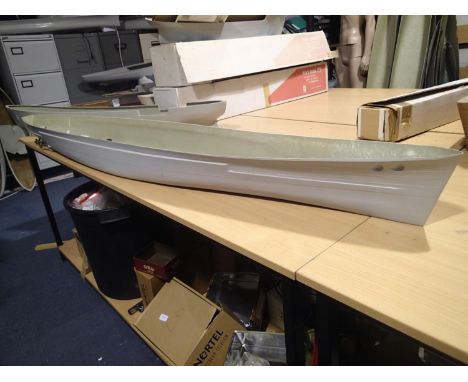 Large fibreglass hull, unknown, fitted with four motors and props plus rudder, L: 195 cm, beam 25 cm. Courier services availa