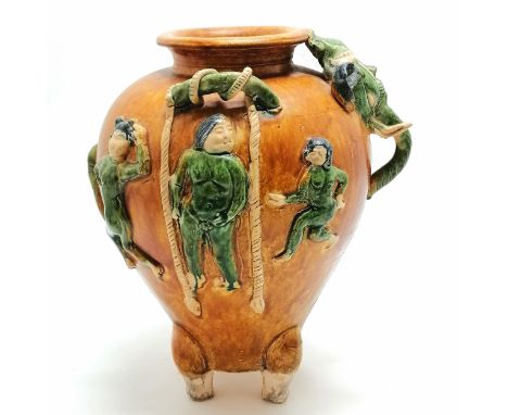Oriental glazed terracotta pot with dancing figures and elephant mask head and tail detail terminating on 4 stile legs - 29 c