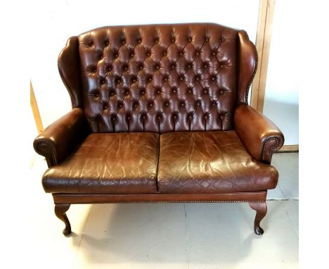 Brown leather 2 seater sofa with button back detail on cabriole legs 130cm long x 85cm deep x100cm high - in good used condit