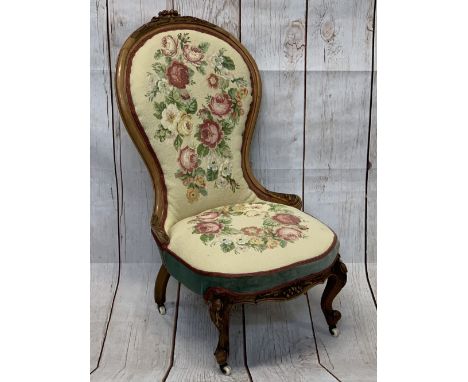 VICTORIAN SPOON BACK SALON CHAIR, carved walnut with floral tapestry style upholstery on white pot castors, 103cms H, 57cms m