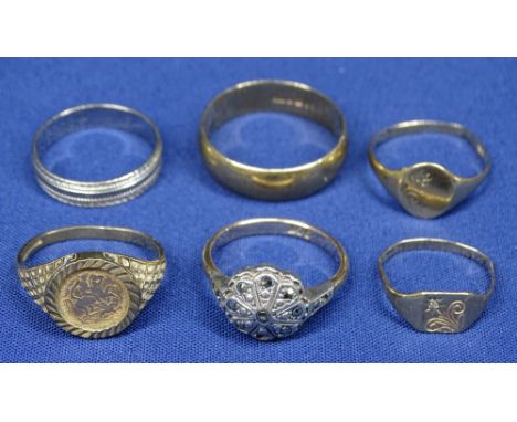 NINE CARAT GOLD RINGS (6) including a wedding band, size T, three signet rings in bent condition, another with marcasites in 