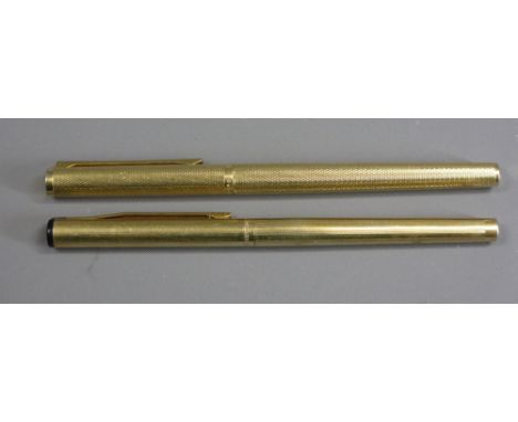 FOUNTAIN PENS (2) - a 1970s-80s Alfred Dunhill gold plated barleycorn patterned with gold plated trim and original 14ct gold 