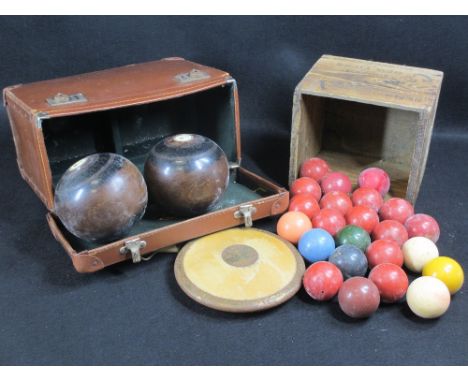 VINTAGE SNOOKER BALLS, wooden discus, hardwood bowling ball (a pair) dated 1951 in a leather effect carry case