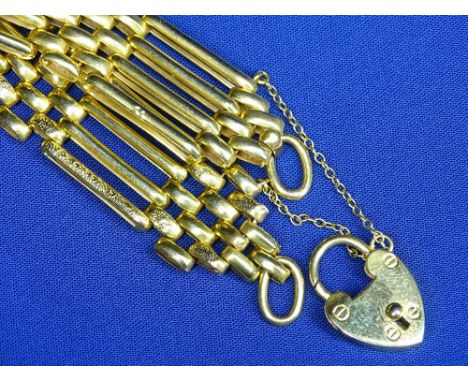 NINE CARAT GOLD GATE LINK BRACELET with padlock clasp and textured decoration to the outer links, 19.6grms
