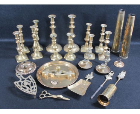 VINTAGE &amp; LATER BRASSWARE to include circular based and other Victorian candlesticks, two brass shell cases, fireside iro