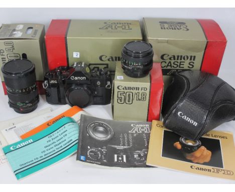 CANNON A1 SLR CAMERA BODY &amp; ASSOCIATED EQUIPMENT - No 1821895 with original warranty card and instruction books, 35mm-70m