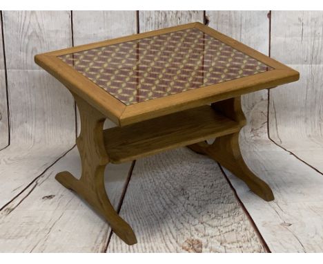 STYLISH OAK COFFEE TABLE with under tier shelf, having a glass topped needlework insert, 46cms H, 64cms W, 57cms D