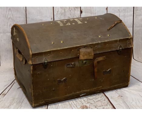 DOME TOPPED CANVAS TRAVEL TRUNK, initialled 'E T' to the top and trace labels for 'GWR Paddington', having brass clips and lo