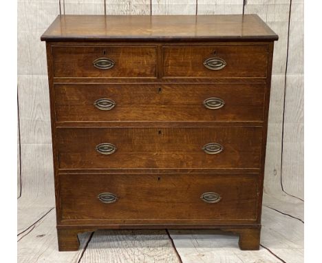 CIRCA 1860 OAK CHEST of two short over three long pine lined drawers, all having replacement oval backplates and swing handle