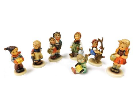 Seven Hummel figures, including Surprise, Apple Tree Girl, School Girl, Grandma's Girl, For Me?, and Pixie. 