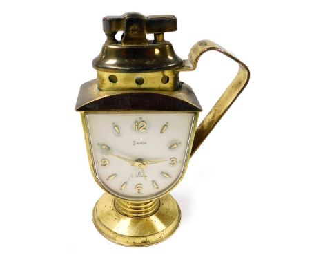 A mid 20thC Swiza brass cased novelty bedside clock, with integral cigarette lighter, shield shaped dial bearing Arabic numer