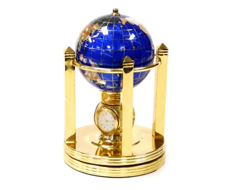 A gem stone globe clock, set with various semi precious stones, on a rotating base with quartz clock, hygrometer and thermome