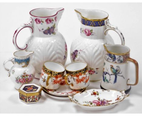 A pair of Royal Crown Derby imari porcelain demitasse coffee cans and saucers, three Coalport porcelain cabbage leaf jugs, an