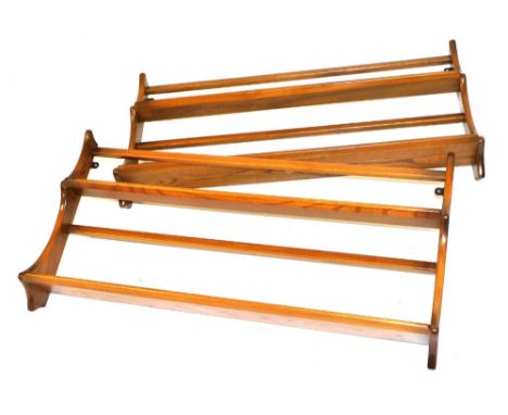 A pair of Ercol elm wall mounted plate racks, each of two shelves, 50cm high, 96.5cm wide. 