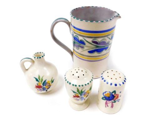 A Carter Stabler Adams Poole pottery jug, decorated with a band of stylized leaves, two Poole pottery pepperettes, and a mini