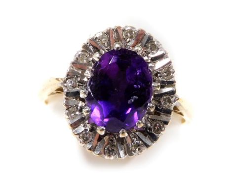 A 9ct gold amethyst and diamond ring, in an oval setting, size L/M, 3.4g. 
