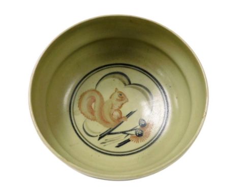 A Carter Stabler Adams Limited Poole celadon pottery trial bowl, decorated with a squirrel and pine cones, painted to undersi