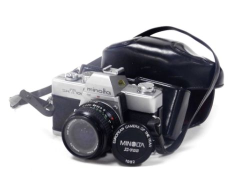 A Minolta SRT101 camera, with a 28mm 1:35 lens, and a 72mm skylight lens. 