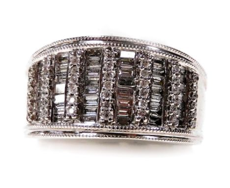 An Iliana 18ct white gold and diamond ring, pave set with twelve rows of alternating baguette and brilliant cut diamonds, siz