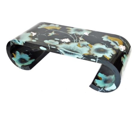 A Chinese lacquer coffee table, decorated with kingfishers and water lilies, raised on scroll supports, 40cm high, 130cm wide