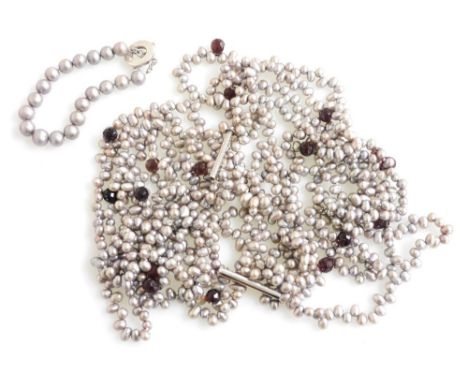 A designer six strand grey fresh water pearl necklace, set with amethyst coloured beads at intervals, together with a grey pe