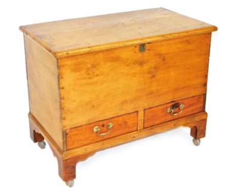 A 19thC pine mule chest, with cast iron hinges, having two frieze drawers, raised on bracket feet, later raised on castors, 7
